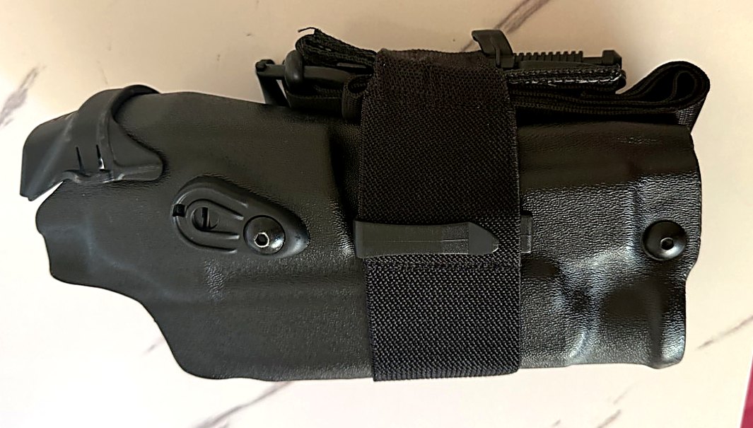 RideStop heavy-duty elastic band and clip installed on a duty holster