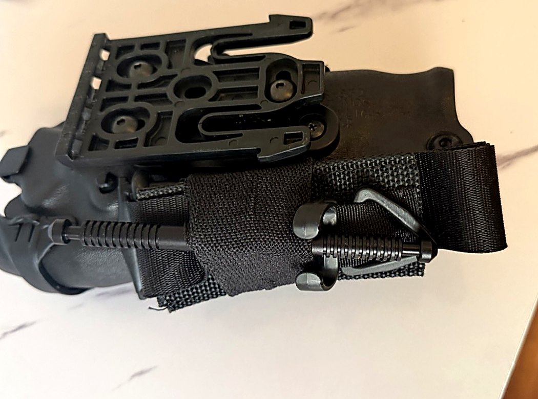 RideStop tourniquet holder and universal duty-holster mount