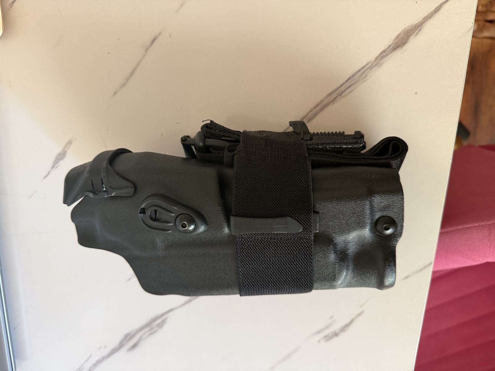 RideStop band wrapped around a duty holster, front view